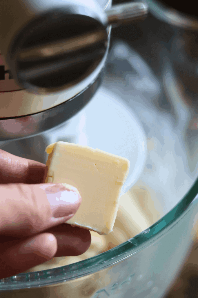 adding butter into the dough