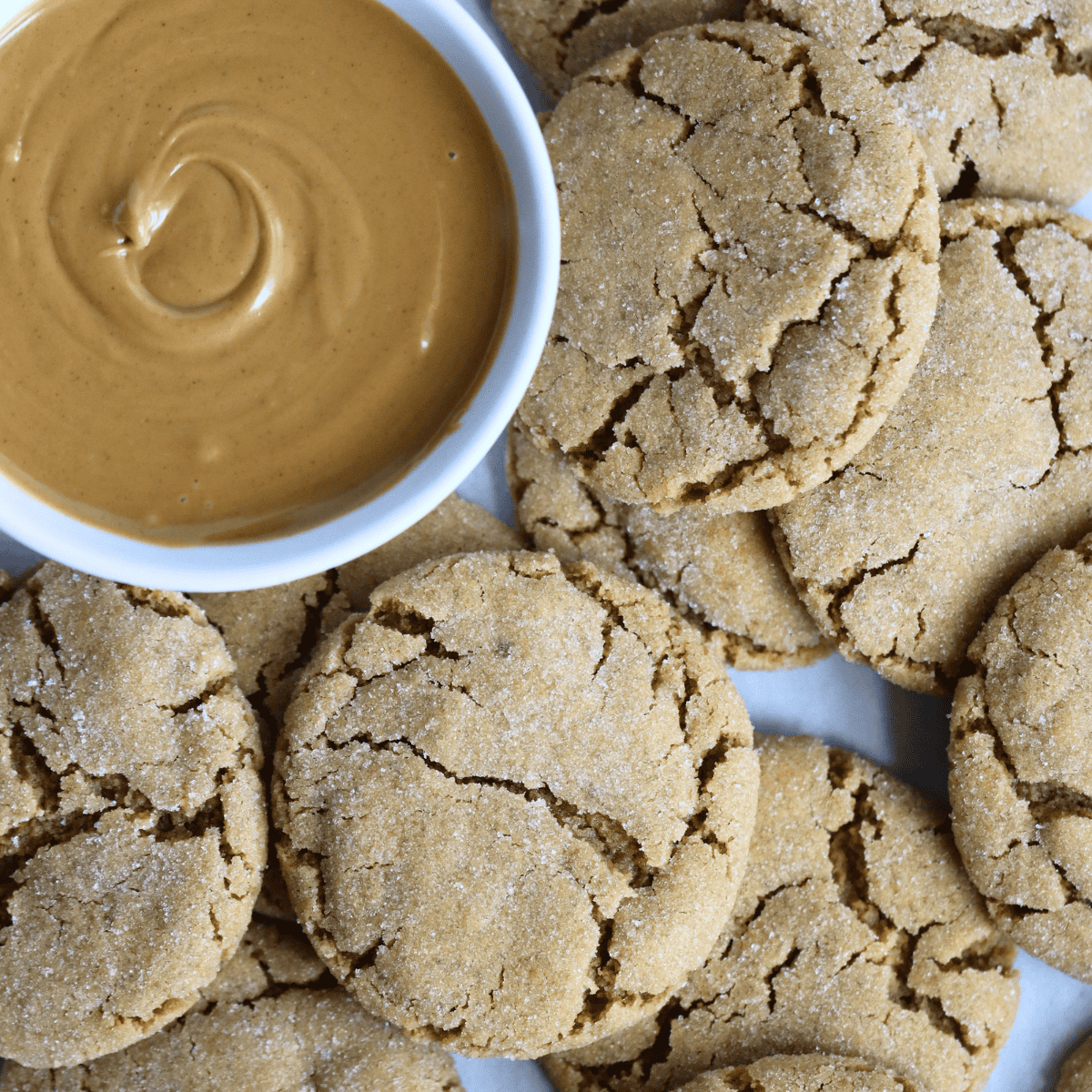sourdough peanut butter cookies and a bowl of peanut butter