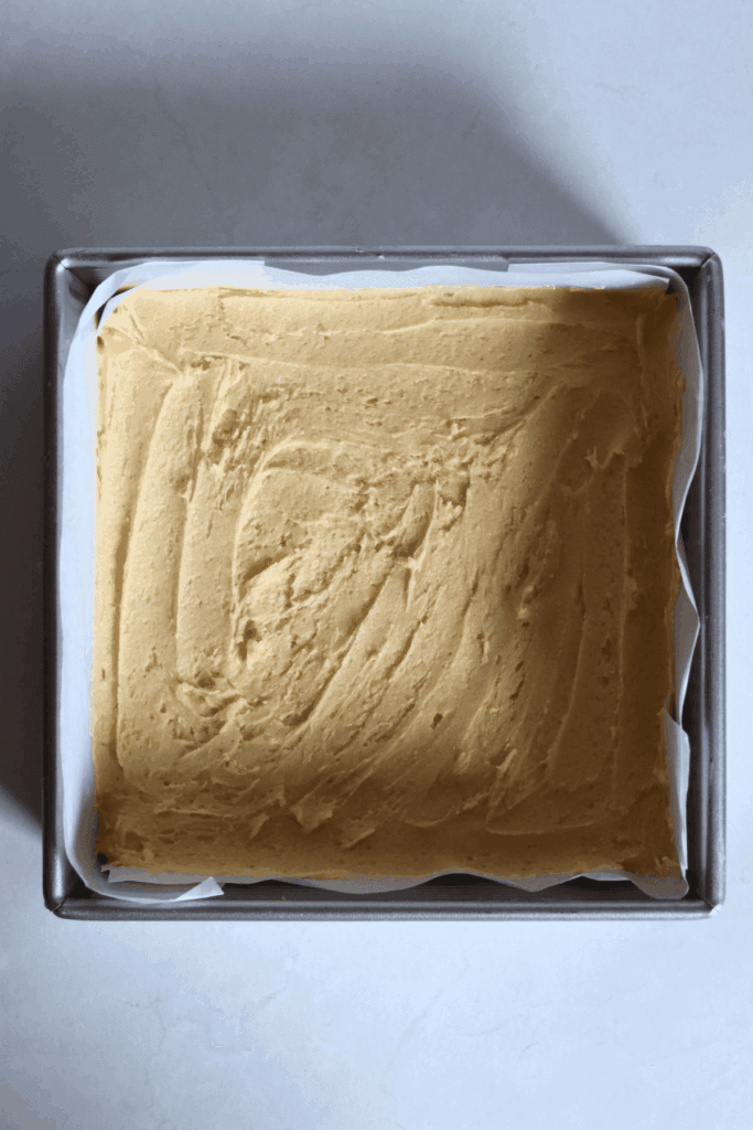 pressed sugar cookie bars dough into the baking pan