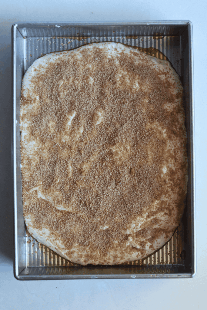 dough with sprinkled with cinnamon