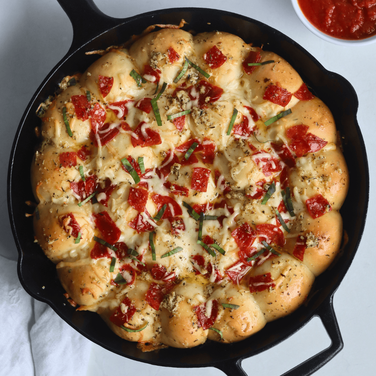 Sourdough Discard Pizza Pull Apart Rolls in a cast iron skillet
