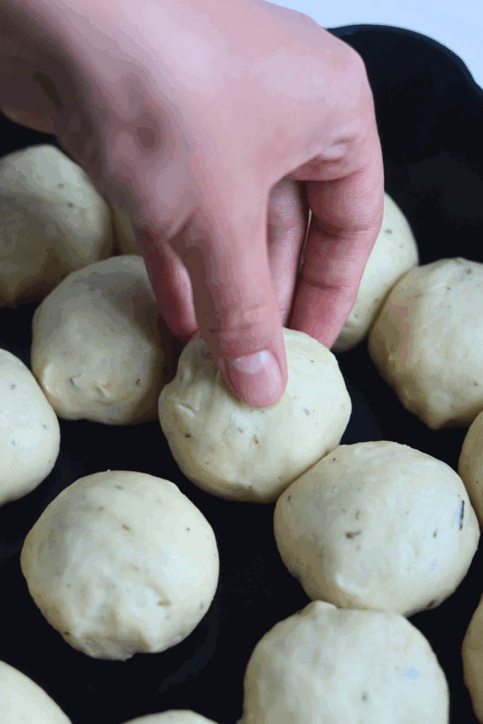 shaped dough placed in cast iron skillet