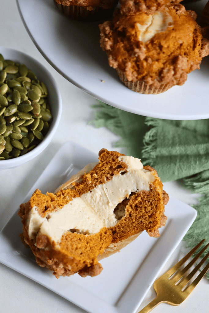 broken in half muffins showing cream cheese