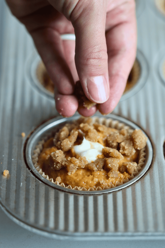 sprinkled crumble topping into the muffin batter
